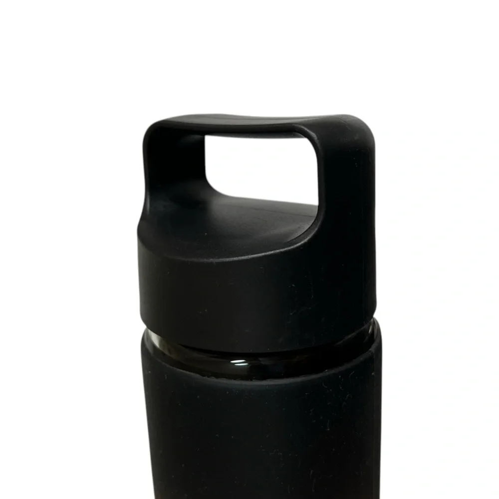 NEW Peleton Water Bottle 16 oz insulated Glass black silicone with paper inside